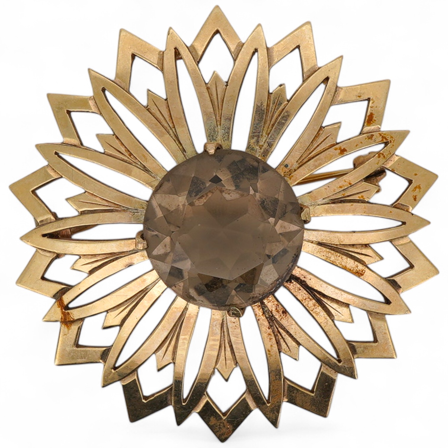 A smoky quartz brooch, set with a circular-cut smoky quartz, within a floral gold surround, 5.7cm diameter, stamped 9CT, maker's mark JF, stamped IVSS, gross weight 17 grams
